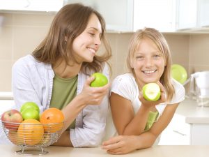 Mother & Daughter Eating Apples
